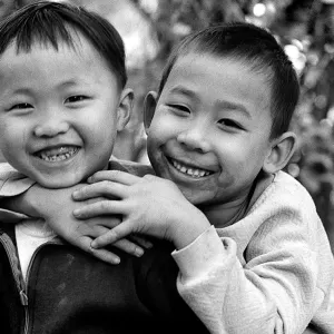 Two boys smiling happily