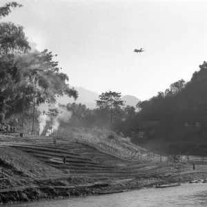 Airplane appearing over Luang Prabang