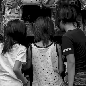 three girls in sweet shop