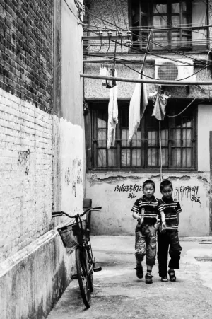 Boys wearing same horizontal-striped polo shirt