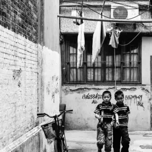 Boys wearing same horizontal-striped polo shirt