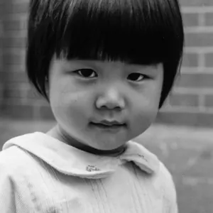 Bobbed haired girl interested in camera