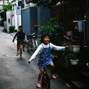 Kids riding unicycle