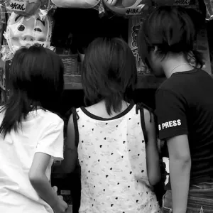 three girls in sweet shop
