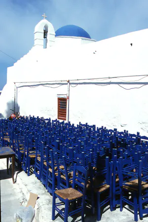 Blue chairs and white church