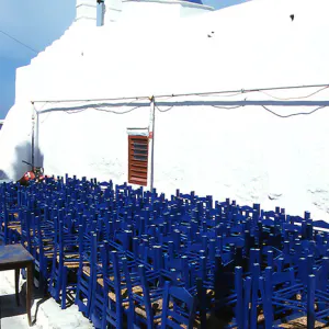 Blue chairs and white church