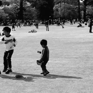 three kids playing on lawn