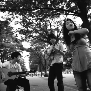 Three street musicians playing
