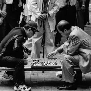 Men Playing Go in park