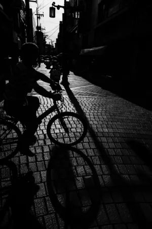 Silhouette of bicycle cutting across