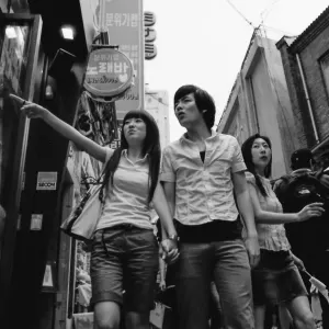 Young couple walking hand in hand