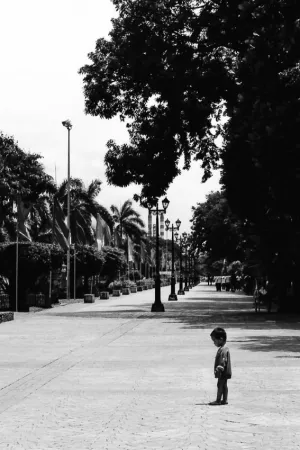Little boy standing alone in Rizal Park