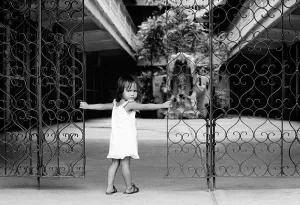 Girl standing at the gate