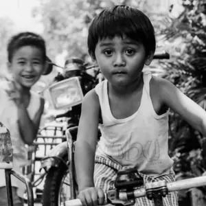 Boy playing on bike