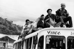 Passengers on the roof of a bus