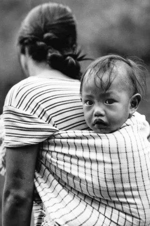 Baby shouldered by mother