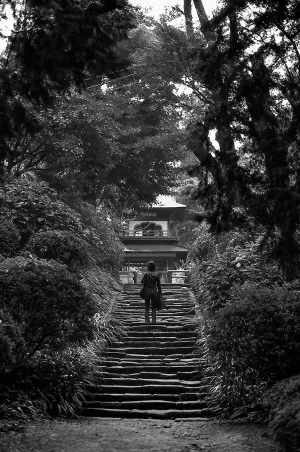 Woman on the stone tattered stairway