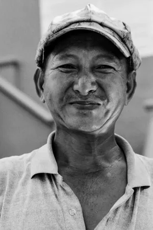 Bashful smile of street vendor