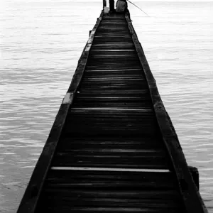 Boys fishing on the edge of pier