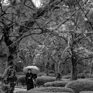 Woman walking in rain