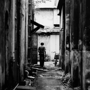 Figure at end of deserted lane