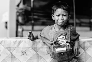 Boy throwing deuce as by-the-way