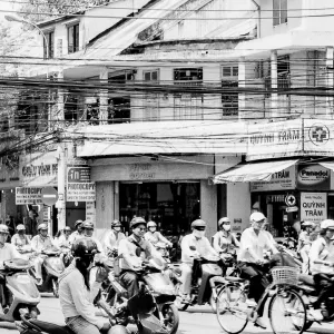 Woman lingering on edge of busy street