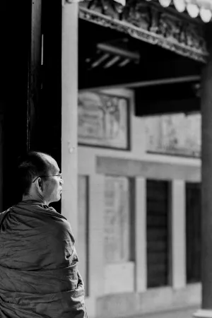 Buddhist monk standing at door