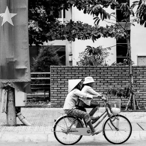 Bicycle passing by national flag