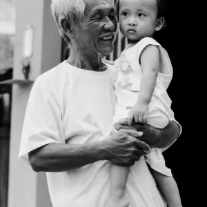 Grandfather holding grandson