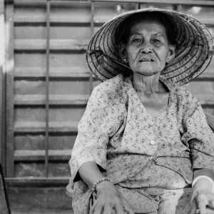 The older woman looking silently