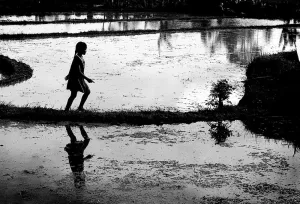 Girl walking along a footpath