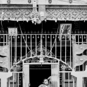 Woman standing at the entrance of Hindu temple