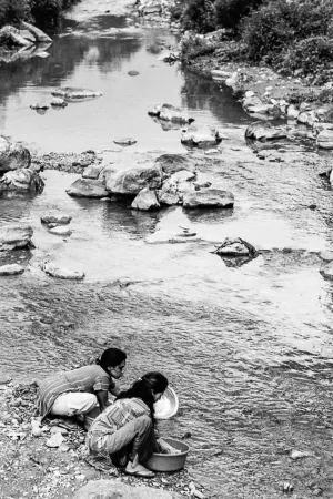 Women washing with river water