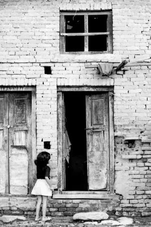 Girl standing in front of door
