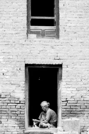 Older woman working at door