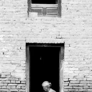 Older woman working at door