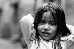 Girl clasping hands behind head