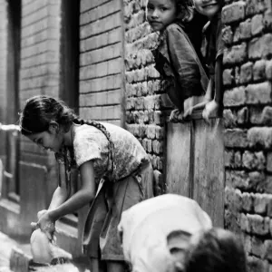 Girl collecting rain water