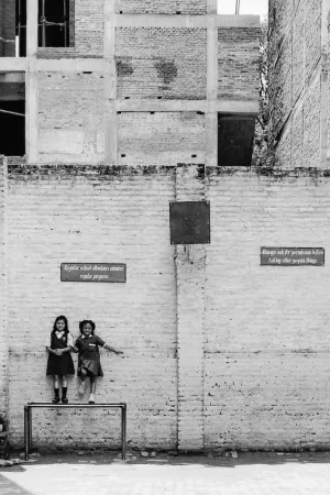 Girls leaning against wall
