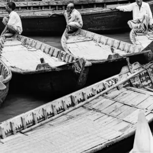 Oarsmen waiting for customers