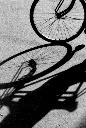 Silhouette and shadow of cycle rickshaw wheel