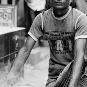 Man carrying steaming pot