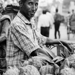 Man selling pineapples