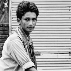 Rickshaw man interested in camera