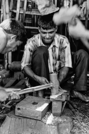 Men in blacksmith\'s workshop