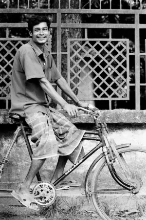 Man smiling on bicycle
