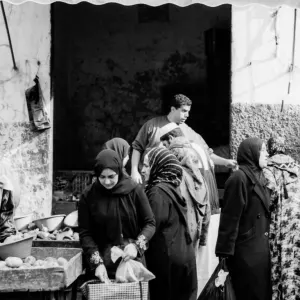 Women buying in street market