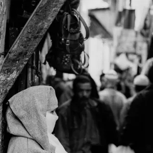 Woman standing in street corner