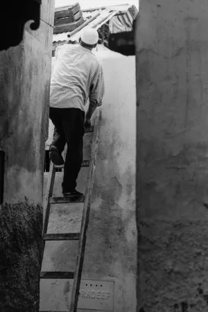 Man standing on ladder